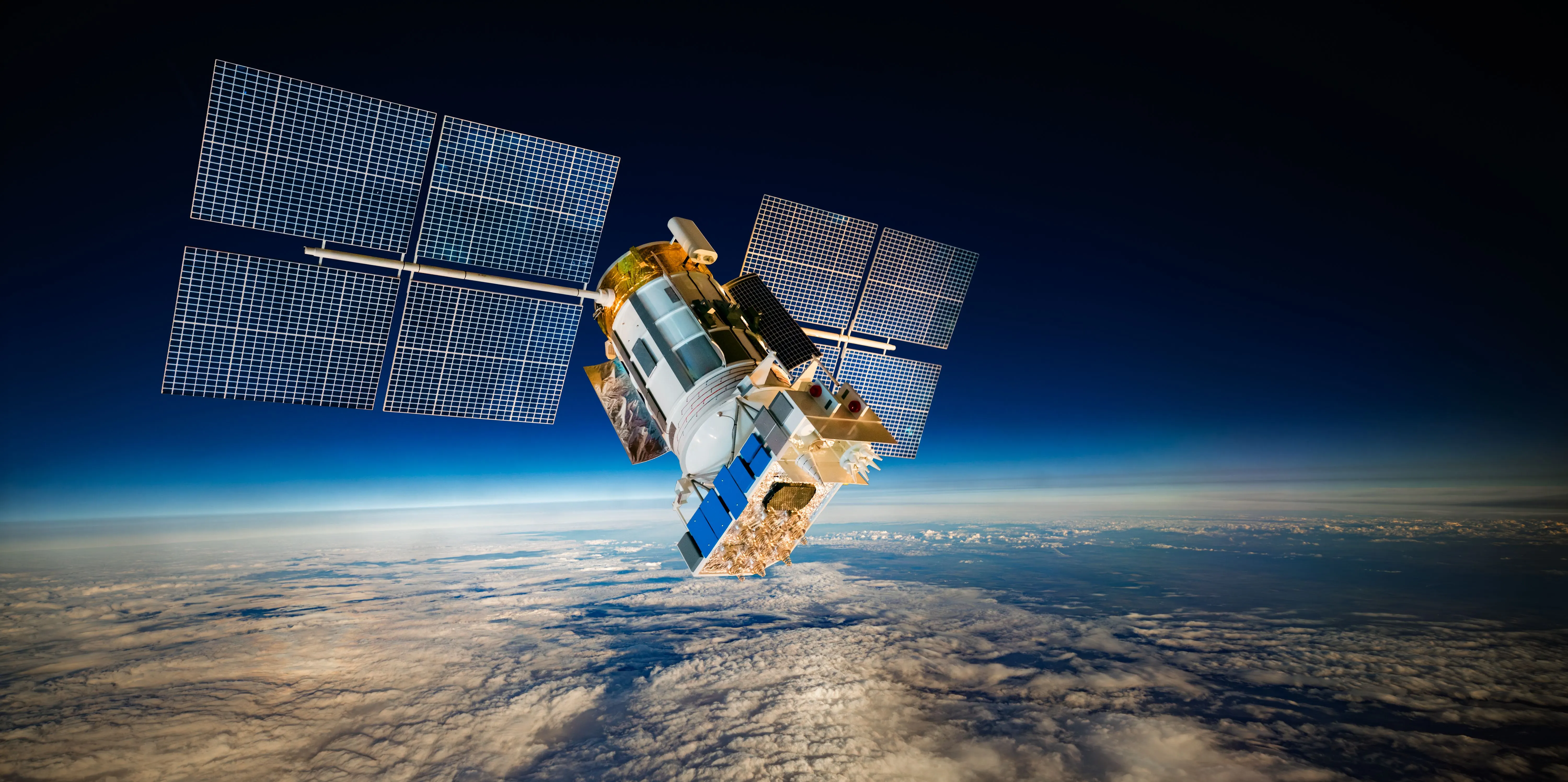 Satellite in low Earth orbit with solar arrays deployed